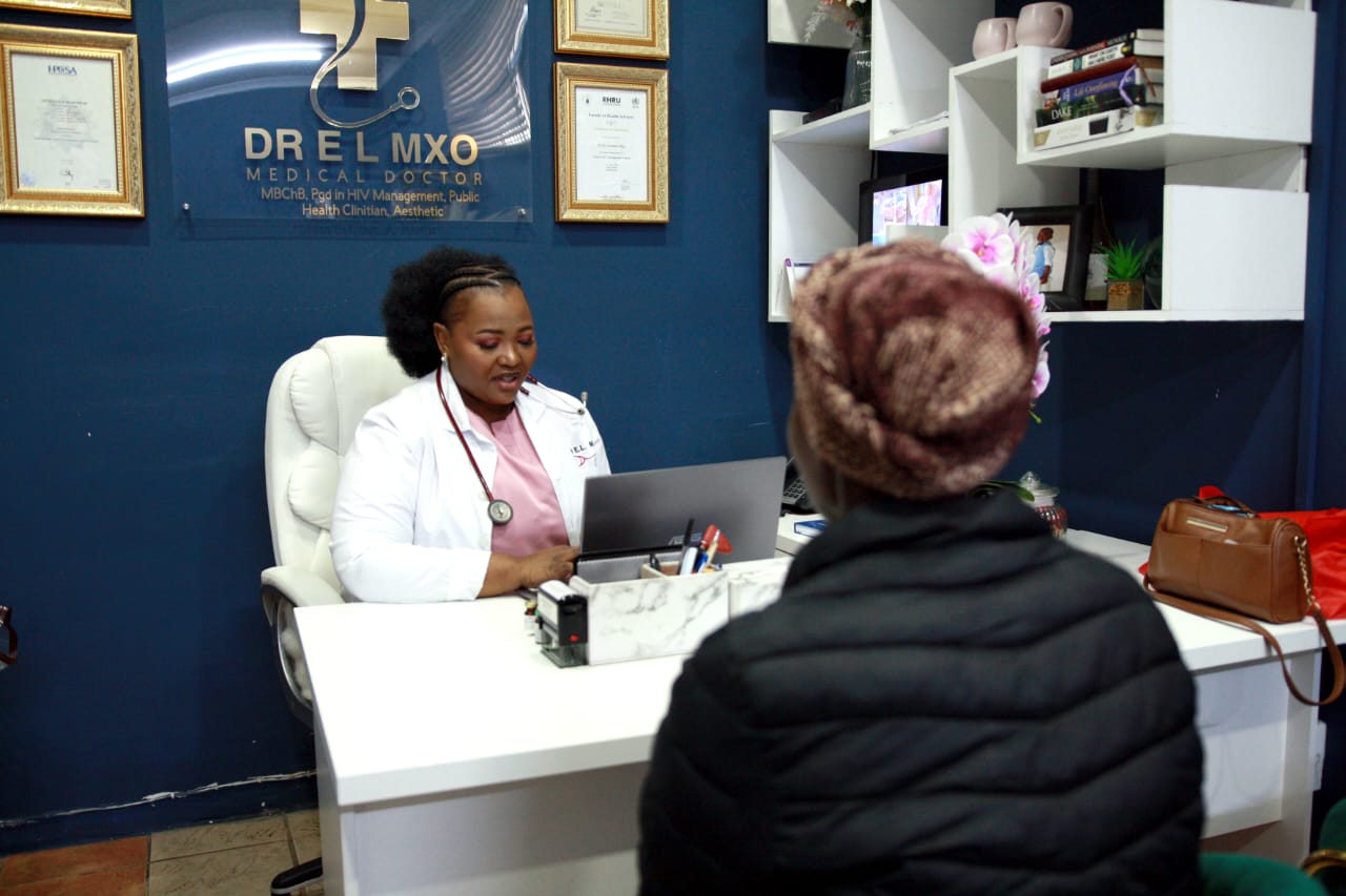 Dr Mxo consulting with a patient