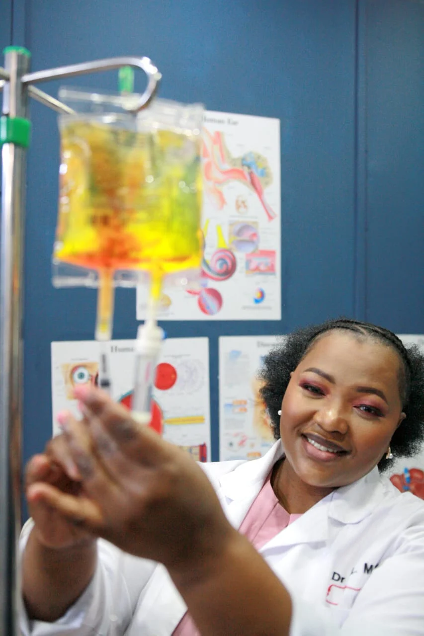 Dr Mxo preparing an IV infusion