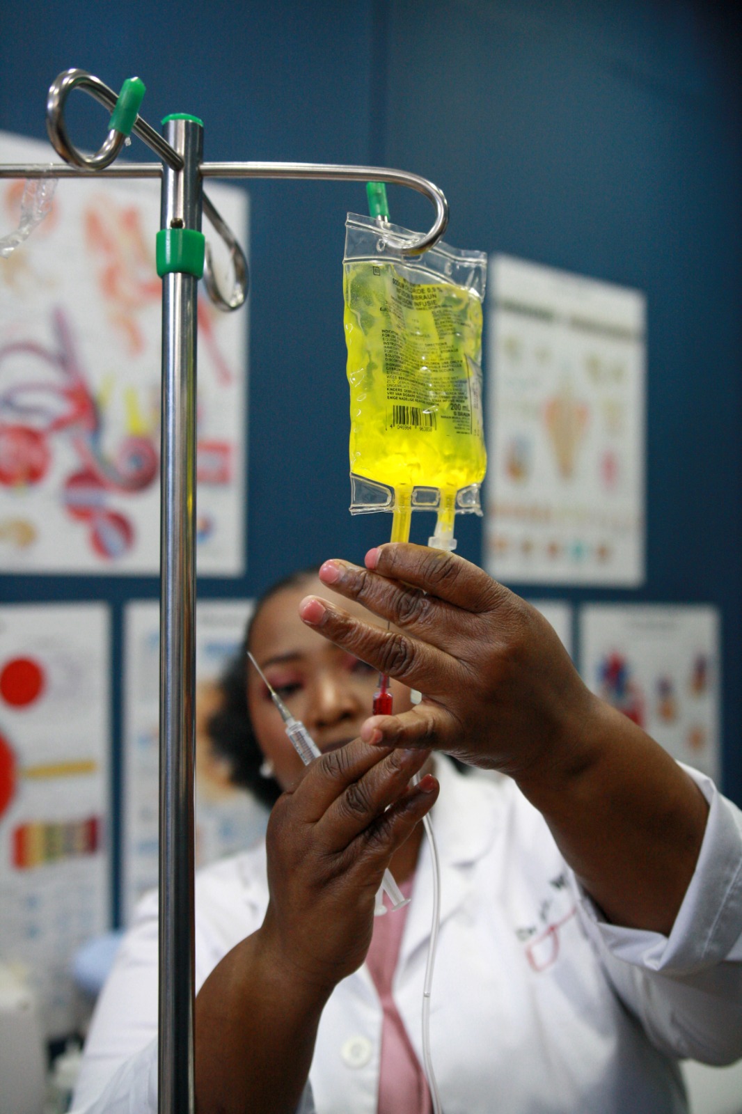 Dr Mxo preparing an IV infusion